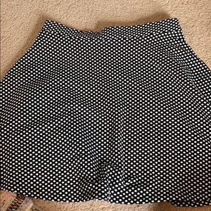 Black and white polka dot skirt.